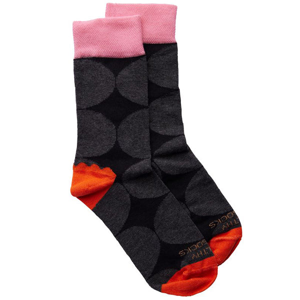 Black socks with large grey circle pattern, orange heel/toe with baby pink ankle cuff