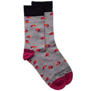 Cream sock with magenta/orange/grey abstract design, black heel/toe and magenta ankle cuff